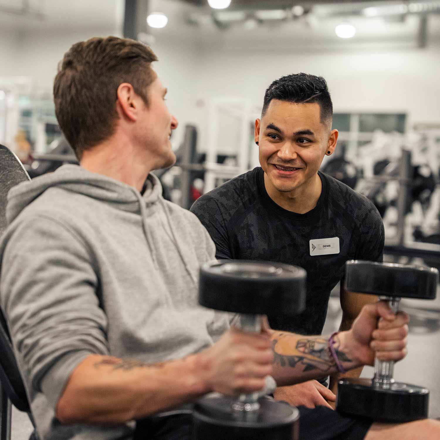 Personal trainer helping client in Calgary
